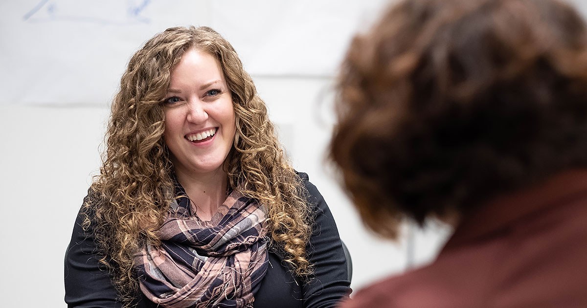 Chelsea talks with a coworker during a Leader Development Course session held at the Corporate Headquarters in October 2019.