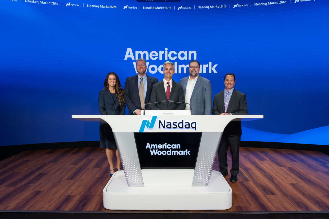 Executive Leadership Team and family at the Nasdaq Marksite Closing Bell